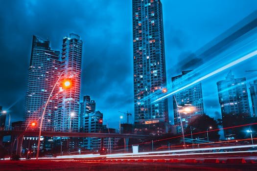 A dramatic long exposure shot showcasing Panama City's skyscrapers and light trails at night. cidade